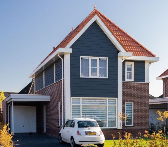 Vrijstaande woningen met houten gevel