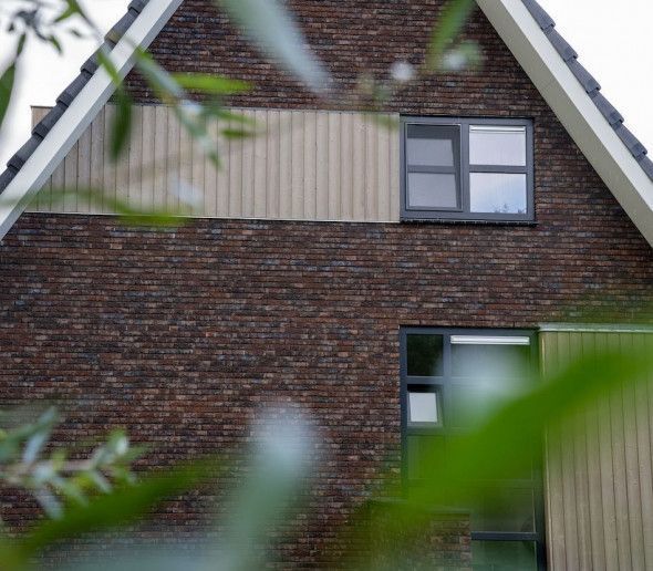 Woning Rottevalle met houten gevelbekleding